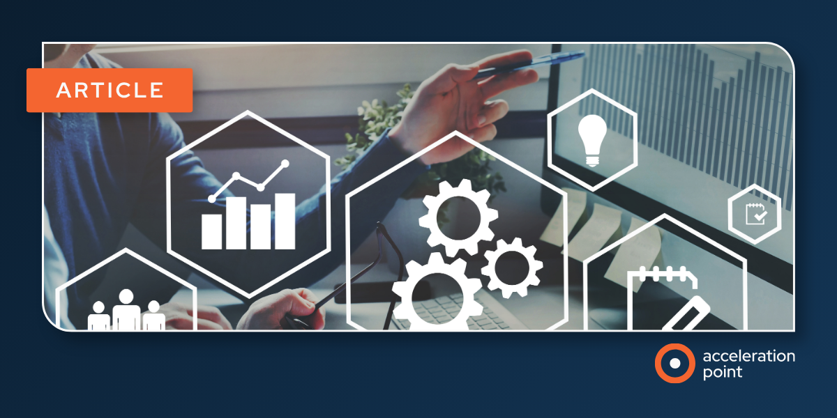 A professional works at a laptop coordinating contract steps, representing centralized, dedicated management of the HCP contracting process.