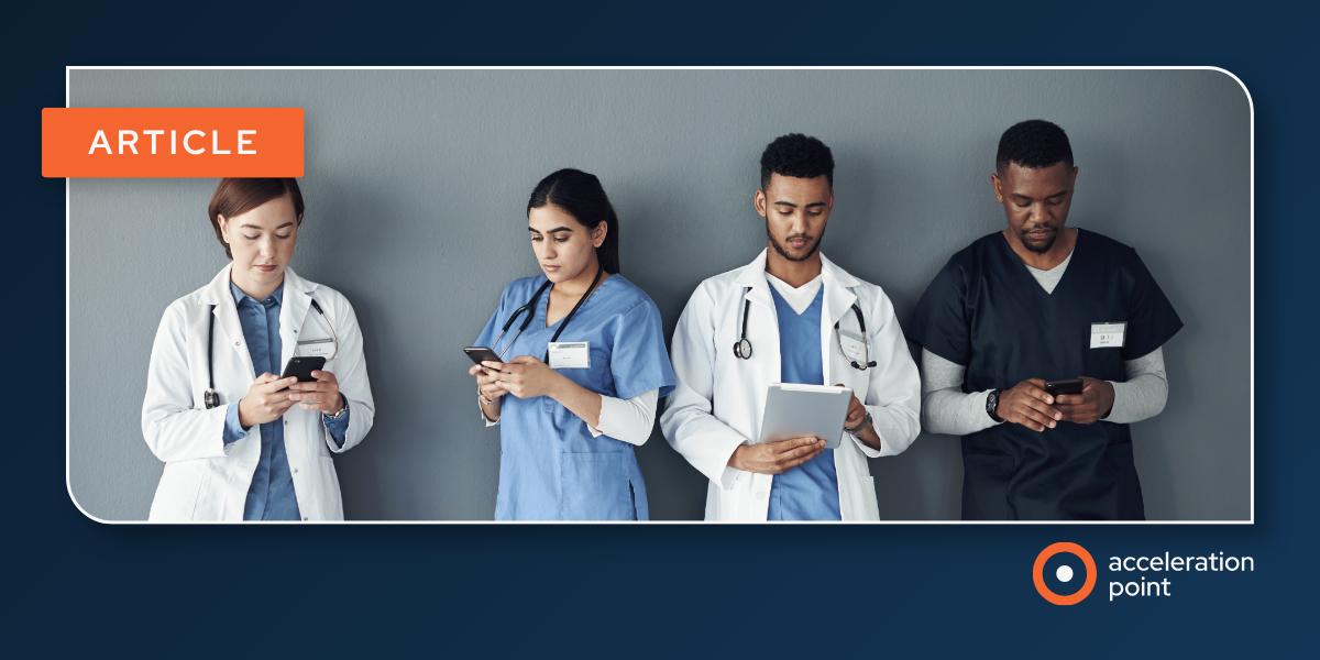 Four clinicians in lab coats and scrubs check smartphones, reflecting why doctors act as digital opinion leaders on social media.