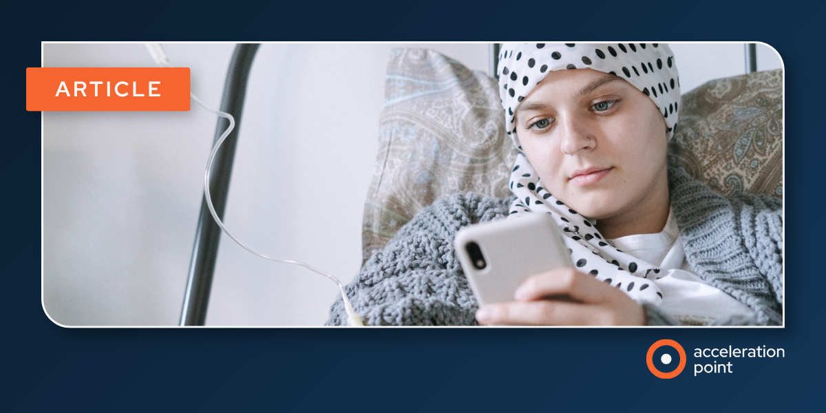 A patient in a treatment chair uses a smartphone, representing the online patient conversations behind patient social listening in Medical Affairs.