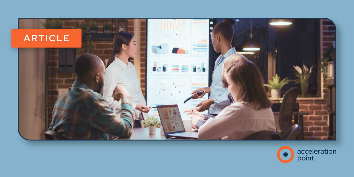 A team reviews data dashboards on a wall screen, illustrating coordinated KOL engagement planning across Medical Affairs functions.